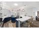 Spacious kitchen featuring a large island, modern appliances, and blue and gray cabinetry at 3259 Markward Dr, The Villages, FL 32163