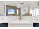 Modern farmhouse sink with gold faucet and white quartz countertops at 3259 Markward Dr, The Villages, FL 32163
