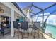 Covered lanai with outdoor bar and seating area at 3259 Markward Dr, The Villages, FL 32163