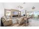 Open living space with a cozy fireplace, and access to a patio at 3259 Markward Dr, The Villages, FL 32163