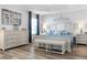 Spacious main bedroom with king-size bed and ample dresser storage at 3259 Markward Dr, The Villages, FL 32163