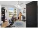 Home office with built-in desk, ample storage, and natural light at 3259 Markward Dr, The Villages, FL 32163