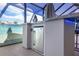 Outdoor kitchen with built-in refrigerator and bar seating at 3259 Markward Dr, The Villages, FL 32163