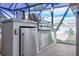 Stainless steel outdoor kitchen with grill and refrigerator at 3259 Markward Dr, The Villages, FL 32163