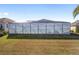 Large screened pool enclosure with a view at 3259 Markward Dr, The Villages, FL 32163