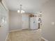 Cozy dining area with tiled floors and a chandelier at 3352 Ne 31St Ter, Wildwood, FL 34785