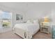 Bright bedroom with a queen-size bed and window at 3403 Rabbit Run Path, The Villages, FL 32163