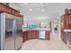 Kitchen with stainless steel appliances and breakfast bar at 3403 Rabbit Run Path, The Villages, FL 32163