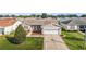 Aerial view of single-story house with landscaped yard at 3525 Idlewood Loop, The Villages, FL 32162