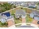 Aerial view of two story house and neighborhood at 410 Cheeota Ct, Minneola, FL 34715
