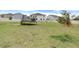 Large backyard with trampoline and playground at 410 Cheeota Ct, Minneola, FL 34715