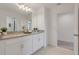 Bathroom with double vanity and access to a linen closet at 410 Cheeota Ct, Minneola, FL 34715