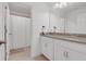 Clean bathroom with double vanity and shower at 410 Cheeota Ct, Minneola, FL 34715