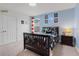 Bedroom with crib and video game themed decor at 410 Cheeota Ct, Minneola, FL 34715