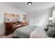 Serene bedroom with a dresser and a comfy bed at 410 Cheeota Ct, Minneola, FL 34715