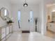 Bright and airy entryway with a large mirror and plenty of natural light at 410 Cheeota Ct, Minneola, FL 34715