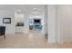 Open concept hallway leading to the living room and staircase at 410 Cheeota Ct, Minneola, FL 34715