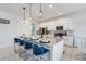 Modern kitchen with stainless steel appliances and a large island at 410 Cheeota Ct, Minneola, FL 34715