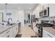 Modern kitchen with stainless steel appliances and an eat-in kitchen area at 410 Cheeota Ct, Minneola, FL 34715
