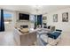 Bright living room featuring a fireplace and plenty of natural light at 410 Cheeota Ct, Minneola, FL 34715