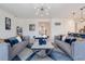 Spacious living room with comfortable seating and a stylish coffee table at 410 Cheeota Ct, Minneola, FL 34715