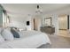 Bright and spacious main bedroom with a large bed and ensuite bathroom at 410 Cheeota Ct, Minneola, FL 34715