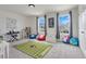 Fun playroom with a football rug and furniture at 410 Cheeota Ct, Minneola, FL 34715