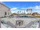 Relaxing pool area with patio furniture and landscaping at 410 Cheeota Ct, Minneola, FL 34715