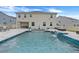 Large rectangular pool with a waterfall feature at 410 Cheeota Ct, Minneola, FL 34715