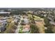 Aerial view of a luxury home community with golf course at 5072 Greens Dr, Lady Lake, FL 32159