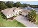 One-story house with a large backyard and paved driveway at 5072 Greens Dr, Lady Lake, FL 32159