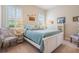 Guest bedroom with white shutters and light blue bedding at 5072 Greens Dr, Lady Lake, FL 32159