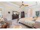 Large Primary bedroom with king bed, walk-in closet and built-in dresser at 5072 Greens Dr, Lady Lake, FL 32159