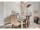 Bright dining room with large window and seating for six at 5072 Greens Dr, Lady Lake, FL 32159