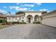 House exterior featuring a covered entryway and brick pavers at 5072 Greens Dr, Lady Lake, FL 32159