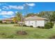 House exterior showcasing landscaping and architectural details at 5072 Greens Dr, Lady Lake, FL 32159