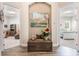Hallway with charming decor and views to bedrooms and office at 5072 Greens Dr, Lady Lake, FL 32159