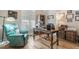 Spacious home office with large desk and comfortable seating at 5072 Greens Dr, Lady Lake, FL 32159