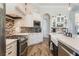 Spacious kitchen with white cabinets, stainless steel appliances, and a large island at 5072 Greens Dr, Lady Lake, FL 32159