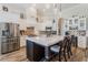 Modern kitchen with white cabinets and a large quartz island at 5072 Greens Dr, Lady Lake, FL 32159