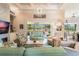 Light and airy living room with comfortable seating and large windows at 5072 Greens Dr, Lady Lake, FL 32159