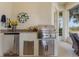 Stainless steel appliances and granite countertops highlight this outdoor kitchen at 5072 Greens Dr, Lady Lake, FL 32159