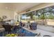 Enjoyable screened porch with beautiful backyard view and seating area at 5072 Greens Dr, Lady Lake, FL 32159