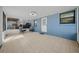 Enclosed porch with tiled floor and bright blue accent wall at 5379 Ne 11Th Ave, Ocala, FL 34479