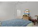 Bright bedroom with dresser and access to hallway bathroom at 5415 Zajac Ave, The Villages, FL 32163