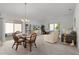 Casual dining area with glass-top table and wicker chairs at 5415 Zajac Ave, The Villages, FL 32163