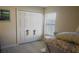 Spacious bedroom with double-door closet and window at 5622 Sir Churchill Dr, Leesburg, FL 34748