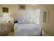 Well-lit bedroom with a queen-size bed and tasteful decor at 5622 Sir Churchill Dr, Leesburg, FL 34748