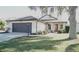 One-story home with attached garage and manicured lawn at 5622 Sir Churchill Dr, Leesburg, FL 34748