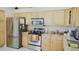 Kitchen with stainless steel appliances and granite countertops at 5622 Sir Churchill Dr, Leesburg, FL 34748